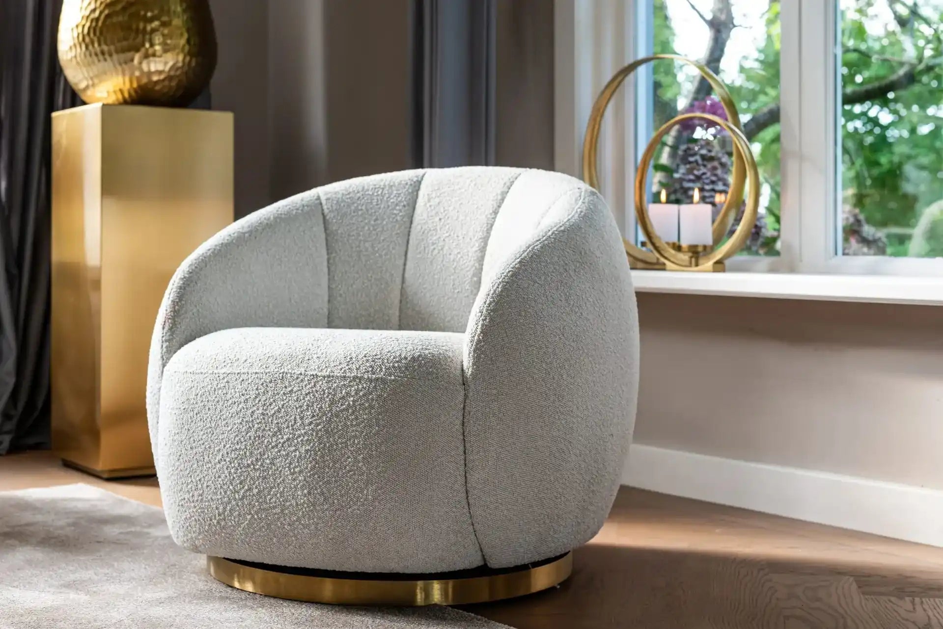 Round, white, plush swivel chair.